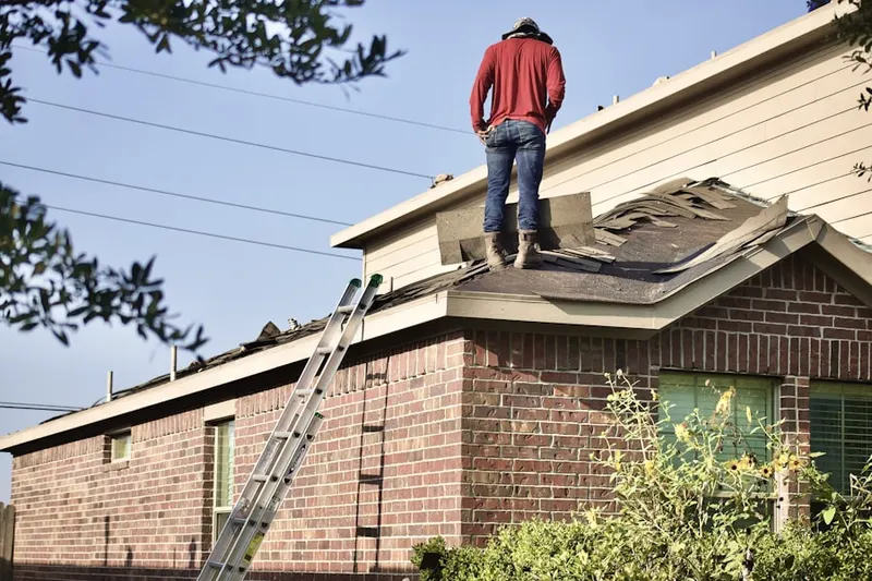 Professional roofer working on a residential roof in Darnestown